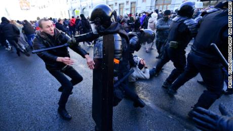 Protesters clash with riot police during a march in Vladivostok on January 23, 2021.